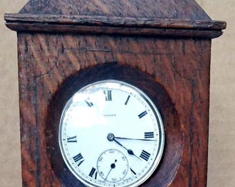 Antique Swiss pocket watch in wooden long-case holder