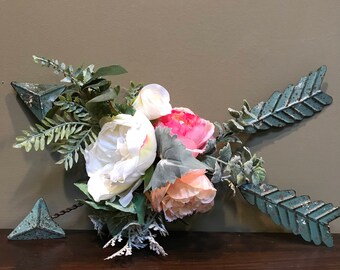 Crossed Arrows with Flowers