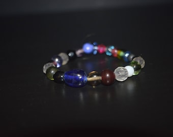 Dark Colored Bracelet With A Hint of Pink and Blue
