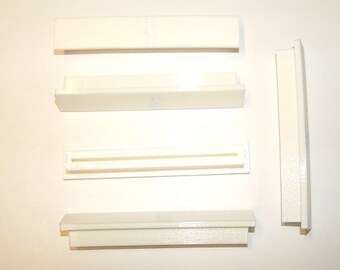 Set of five Nintendo Famicom PCB cartridge dust covers.