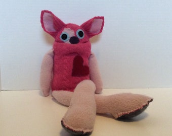 Small, soft hot pink monster
