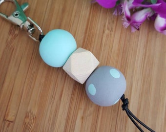 Polymer clay keyring with mint, grey and timber beads.