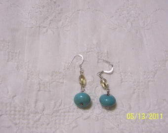 Turquoise Color Magnesite and crystal dangle earrings.