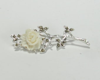 Broach of Soft White Lucite Rose Accented with Marcasite on Silver Stem