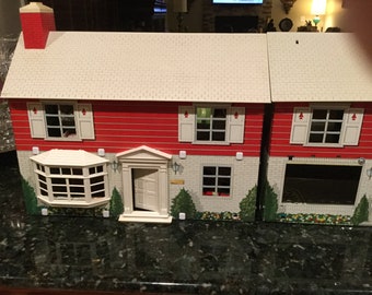 2 Vintage Marx 2 story colonial style tin doll houses from the 1960’s with 74 Marx pieces of-furniure and 19 people.