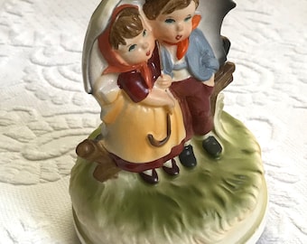 music box . Hummel style music box . porcelain music box . raindrops are falling on my head