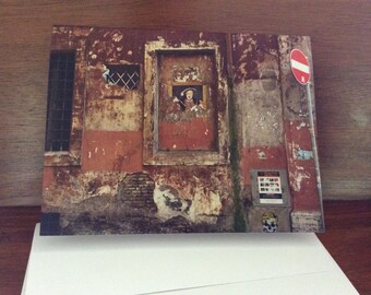 Photo of a wall in Rome,Italy. A set of five cards with envelopes.
