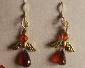 Garnet and gold angel earrings. January birthstone