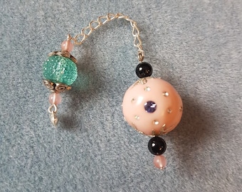 Pendulum with obsidian and cherry quartz gemstone