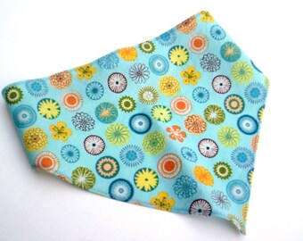 Blue Yellow And Orange Sprials On Girls Head Scarf