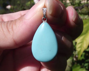 1 PENDANT BEAD TURQUOISE WITH 24 X 17 X 6 MM RING.