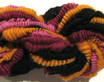 Handspun yarn Bonita supercoil bulky art yarn 24 yards black pink orange maroon merino knitting supplies crochet supplies Waldorf doll hair