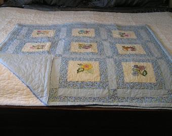 Handmade baby or lap quilt with embroidered jacobean designs