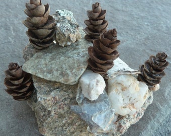 Zen rock garden sculptured from Colorado rocks, mountain glass and tiny pinecones, miniature sculpture from Colorado, original rock art