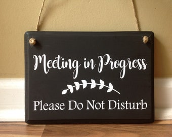meeting in progress door sign