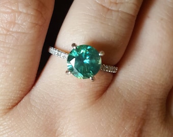 Green moissanite silver ring with accent