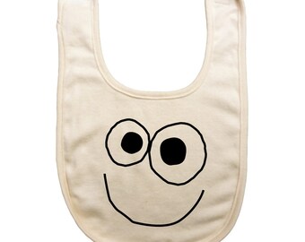 Organic cotton baby reversible bib with screen printed happy face design on the front and yum yum on the back by Bugged Out, made in the USA