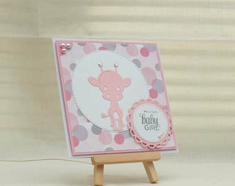 Handmade welcome baby girl card with giraffe and circles in pink/white and grey