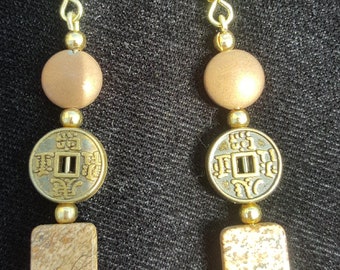 Jasper tile stones with Asian medallions and copper metal discs