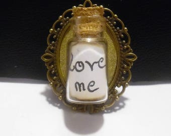Cameo brooch and steampunk vial