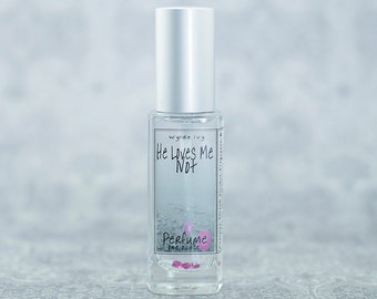 He Loves Me Not a Darkly Sweet Fragrance with Notes of Vanilla, Jasmine, Orchid, Musk, and Wood