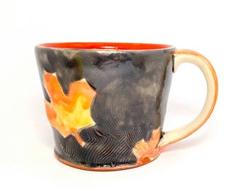 Grey maple leaf themed Earthenware mug. Wheel thrown, food safe leafy mug made by Kaitlyn Brennan