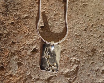 Female pendant silver plated, silver pendant and gold pendant.