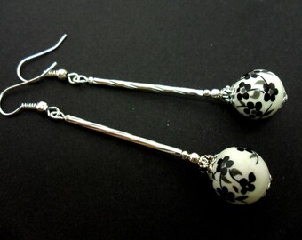A pair of pretty porcelain flower bead long dangly earrings.