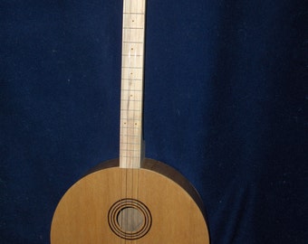 Four stringed round guitar