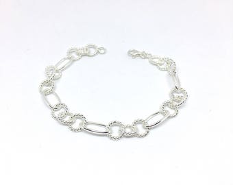 Bracelet links twisted in sterling silver.