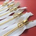 YKK metal zippers with Gold (Brass) finish and DHR wire style pull-closed bottom- (5) pieces - White Color 501- 9, 12, or 18 inches