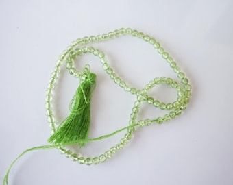 1 strand of green 2mm glass beads