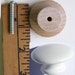 1 knob if you need less than the listing offers, small orders from sets that are 23.50 and below on white knobs. 2.85