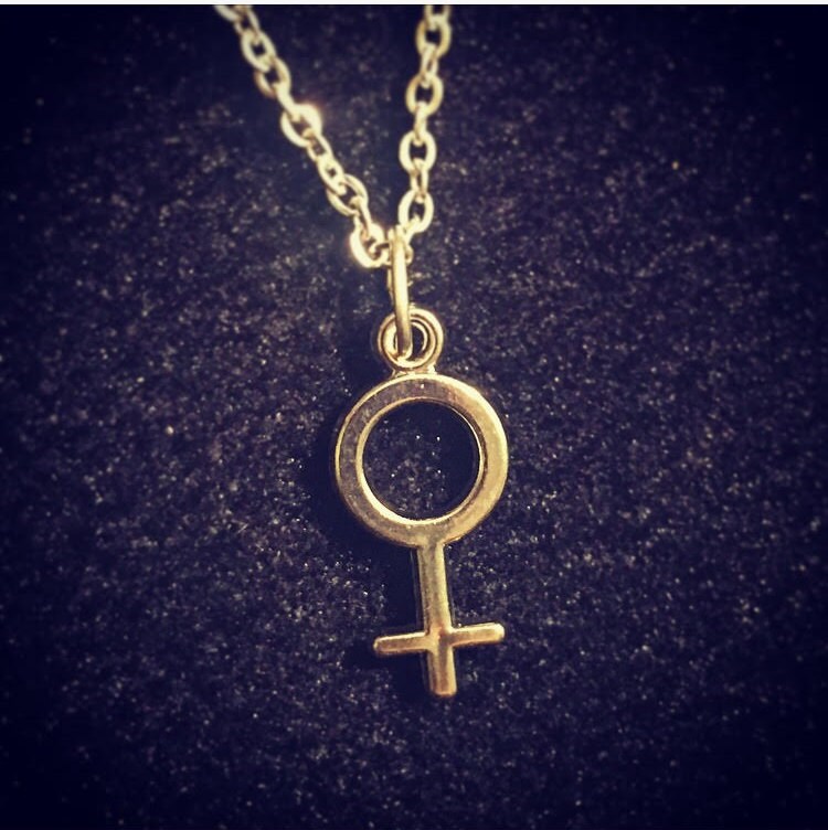 Venus female symbol pendant gender equality. Antique-silver