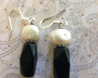 Jet and pillow pearl earrings on sterling silver.