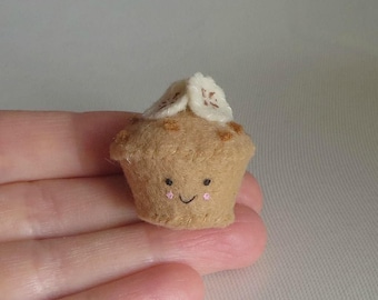 Banana nut muffin miniature felt plush with smling face stuffed toy with sliced bananas and nuts on top