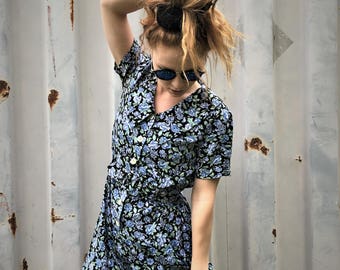 Vintage 90's black with blue floral belted short sleeved button-down romper / jumper...