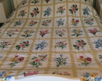 A large French double Quilt.