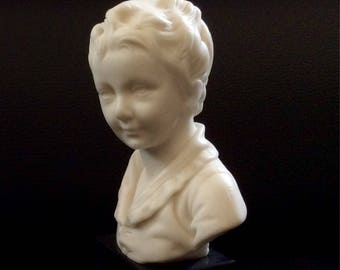 Reproduction of a bust of a boy made by sculptor Houdon.