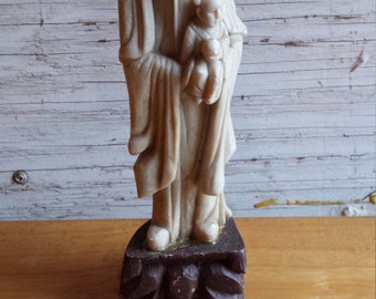 Buddhist monk holding a child