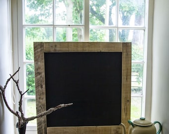 Chalkboard made from reclaimed pallet wood with chalk shelf.