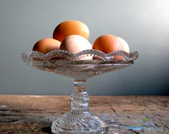 A vintage French clear glass compotier, pressed glass pedestal plate, serving dish