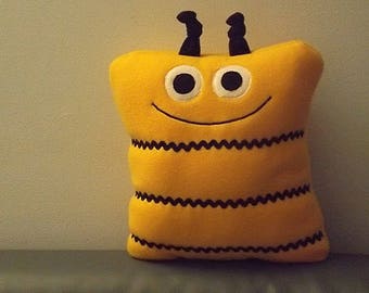 Bee plush pillow pet in bright yellow fleece with black trim