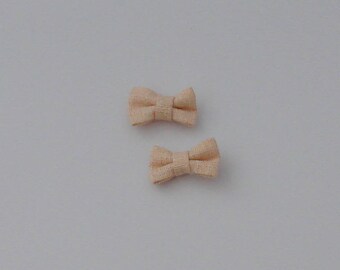 5 27x16mm cream-colored fabric bows