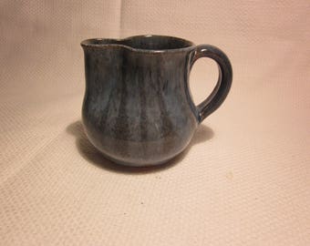 Small signed pottery creamer/pitcher