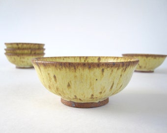 Five Small Yellow Speckled Pottery Bowls