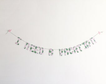 I Need A Vacation banner on tropical paper