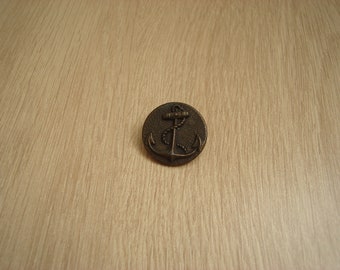 bronze metal button with anchor