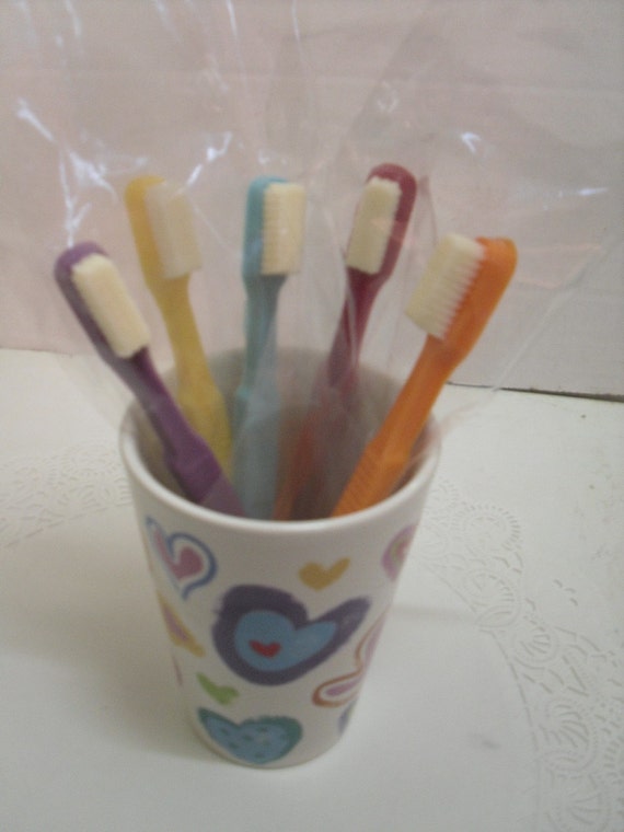 Half a dozen adult size chocolate toothbrushes