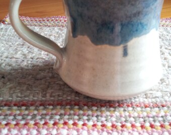 New 10 oz mug in Creamy White with blue rim.
